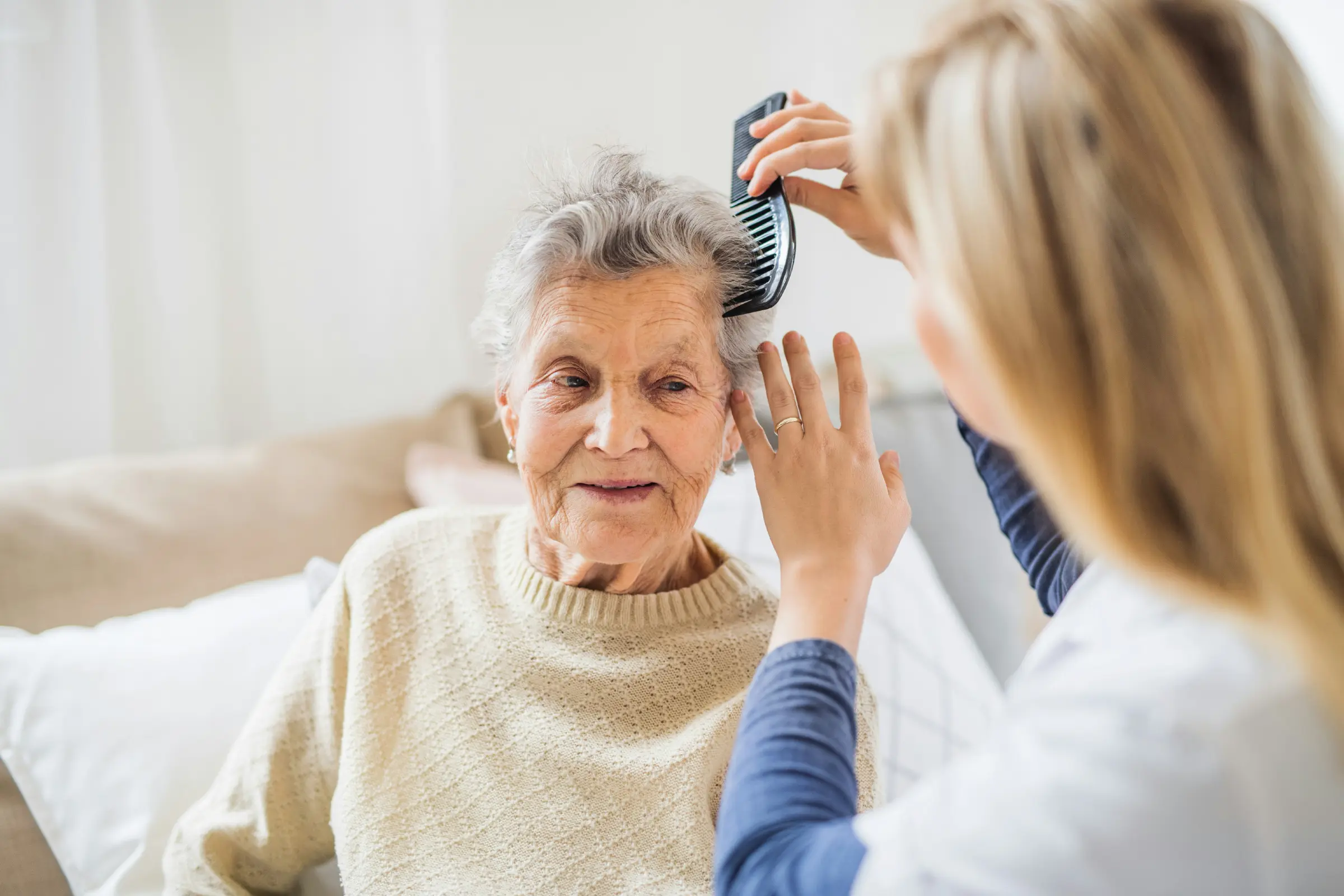 Caregiver assisting a resident at Sorrento Retirement Residence in Bolton