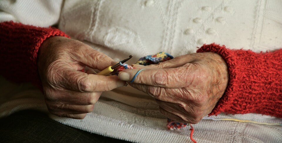 person crocheting